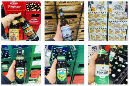 Hand hält verschiedene Bierflaschen wie Ayinger, Störtebeker und Binkert im Getränkemarkt Getränke Star in Trier